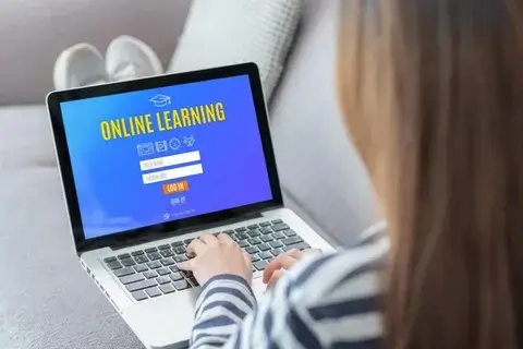 An online learning portal shown on a laptop.